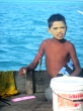 Bajau Laut Boy with Traditional Sunscreen on Houseboat, Semporna, Malaysia